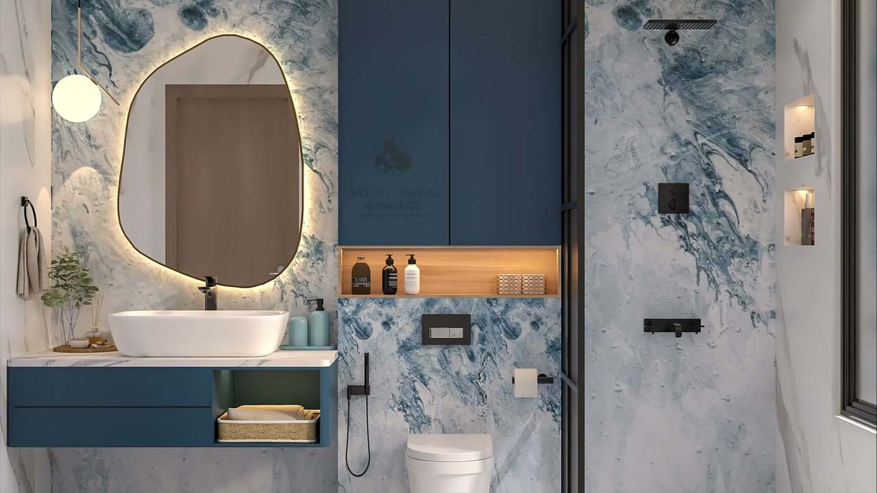 Compact bathroom wrapped in blue-and-white marbled stone, with a halo-backlit pebble-shaped brass-rimmed mirror, teal floating vanity and white vessel basin, an inky-blue tall cabinet over a lit oak niche and a black-framed walk-in shower.