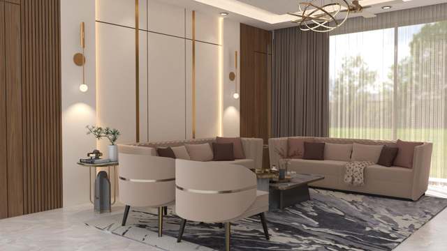 Corner of the same drawing room: blush tub chairs with gold bands, an L-shaped sofa and a garden seen through full-height glass