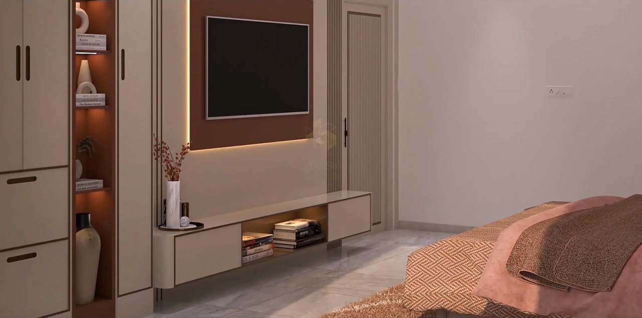 Opposite wall of the terracotta bedroom: a floating ivory TV console with lit book niche below a rust panel ringed in warm LED, a lit terracotta display niche with ceramic vases between ivory wardrobes, a fluted door and the edge of the rose chevron bed.