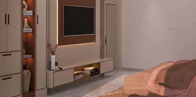 Opposite wall of the terracotta bedroom: a floating ivory TV console with lit book niche below a rust panel ringed in warm LED, a lit terracotta display niche with ceramic vases between ivory wardrobes, a fluted door and the edge of the rose chevron bed.