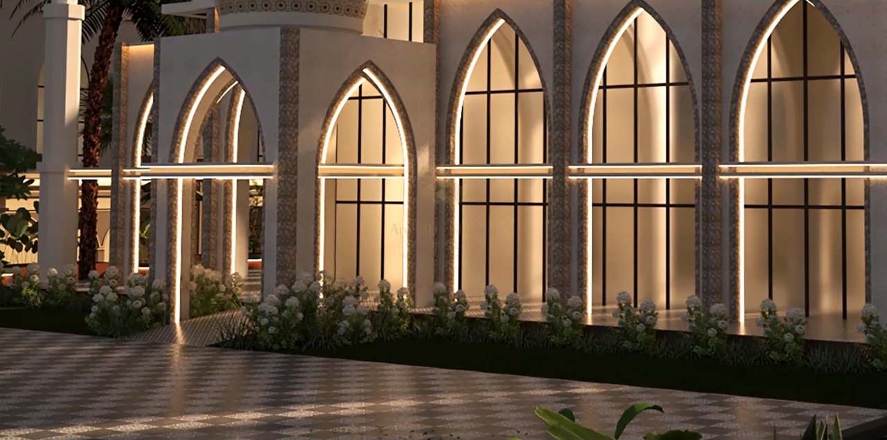 Night detail of the mosque arcade: pointed arches outlined in warm LED strips, glowing amber glazing with black mullions, mosaic pilasters and a bed of white hydrangeas above a softly lit checkerboard plaza.